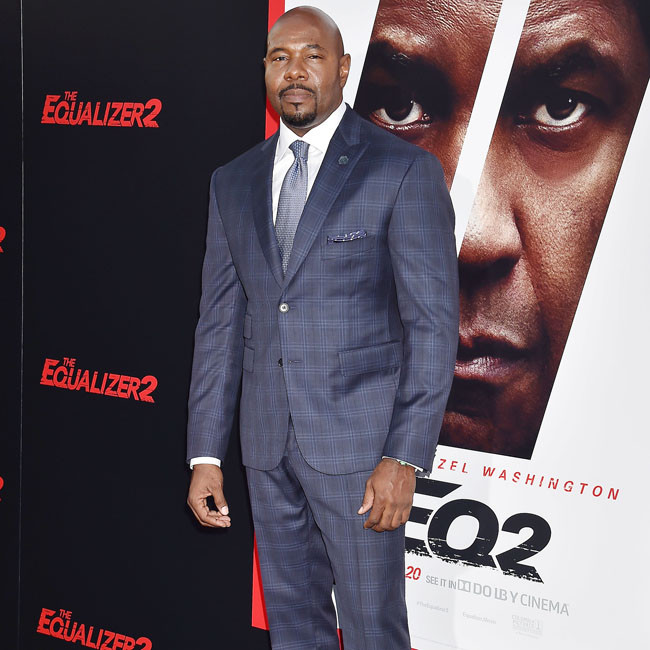 'People love seeing him deliver justice': Antoine Fuqua credits Denzel Washington for The Equalizer's success