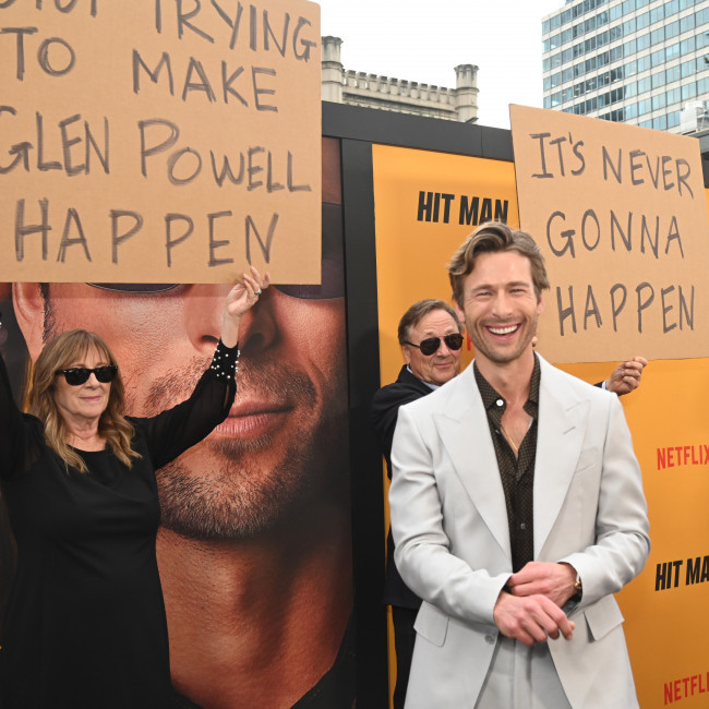 Glen Powell reflects on playing 'a lot of different characters' in Hit Man: 'It's the greatest joy'